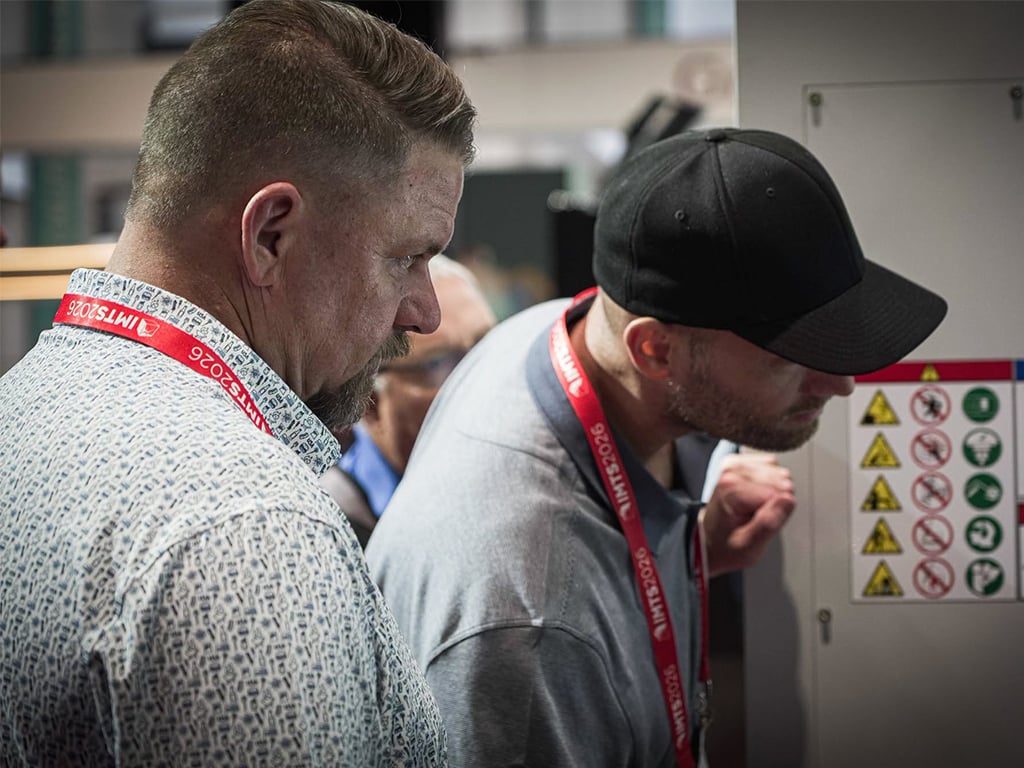 HAAS IMTS26 Attendees checking out machine